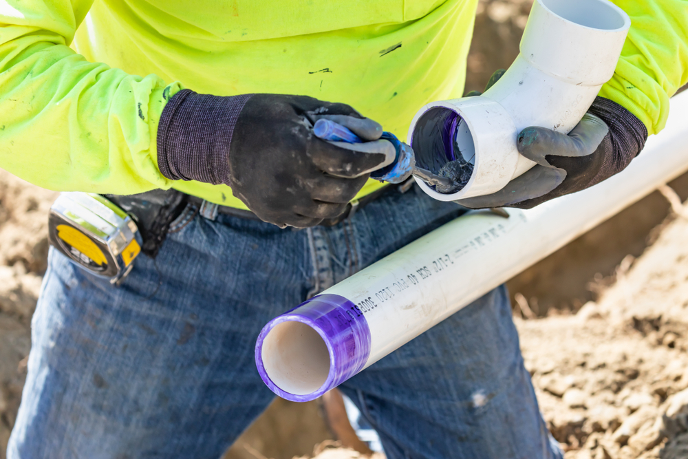 plumber applying pipe cleaner PVC pipes Waimea, HI