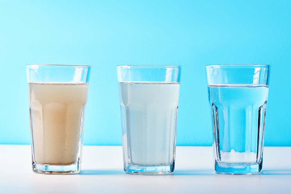 discolored water in a drinking glass